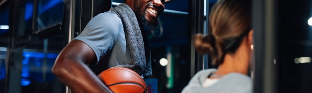 Smiling athlete holding basketball